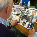 Client living with dementia viewing their collage