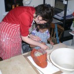 A workshop with young students, handbuilding planter project.