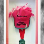 Medal and baseball cap for breast cancer charity walk