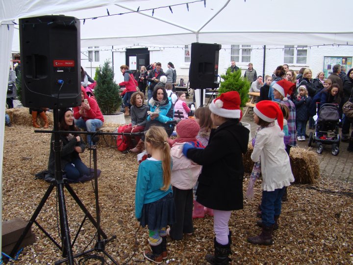 Project Performers singing at Lupton's Christmas event