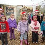 Project Performers singing at Lupton's Christmas event